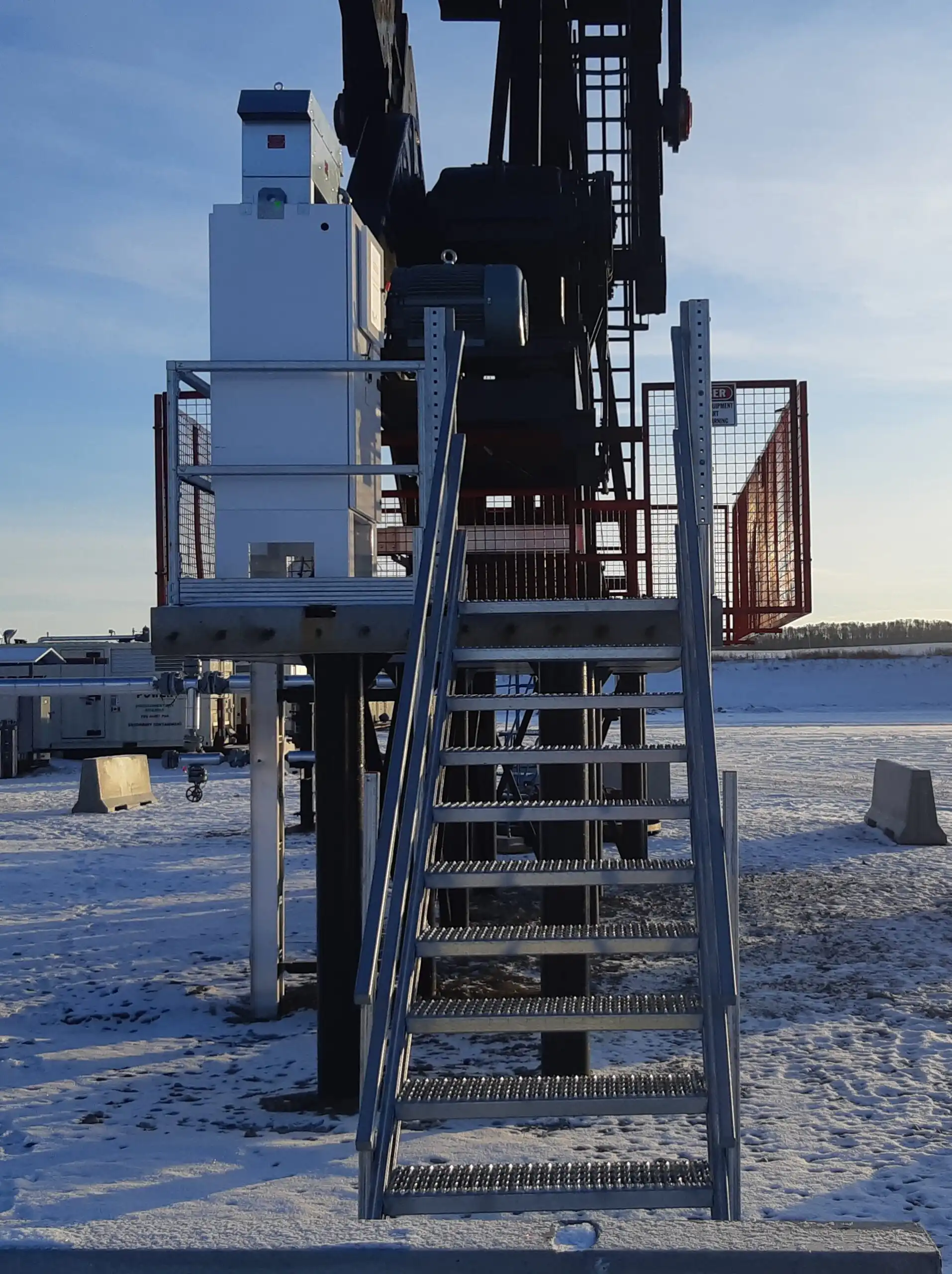 Mechano Max bolt-together modular steel staircase for pump jack industrial access in Alberta