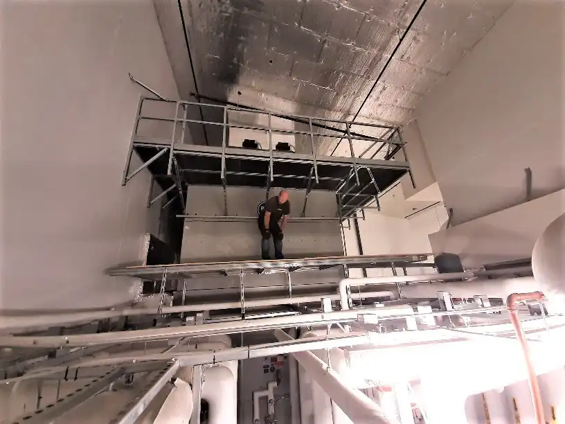 Mobile Access Platforms: Custom Modular Steel Solutions 1 Mechano Max temporary mobile access platform installed above a ceiling grid for industrial maintenance